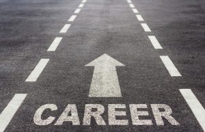 The word Career painted on a road with an arrow