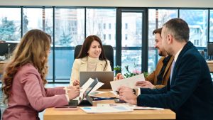 Four colleagues in a meeting at a boardroom table