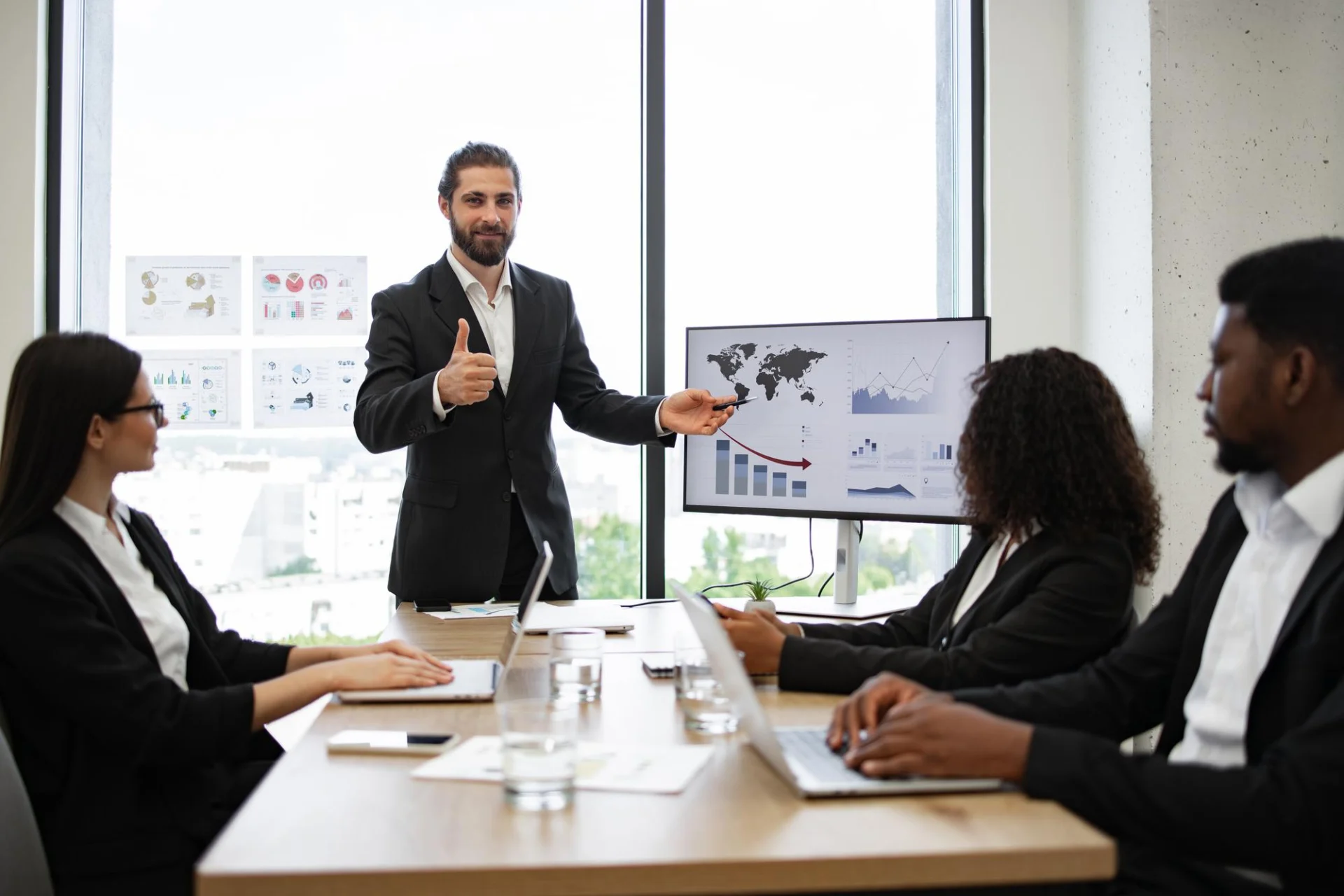 A business development manager presenting to colleagues with performance charts