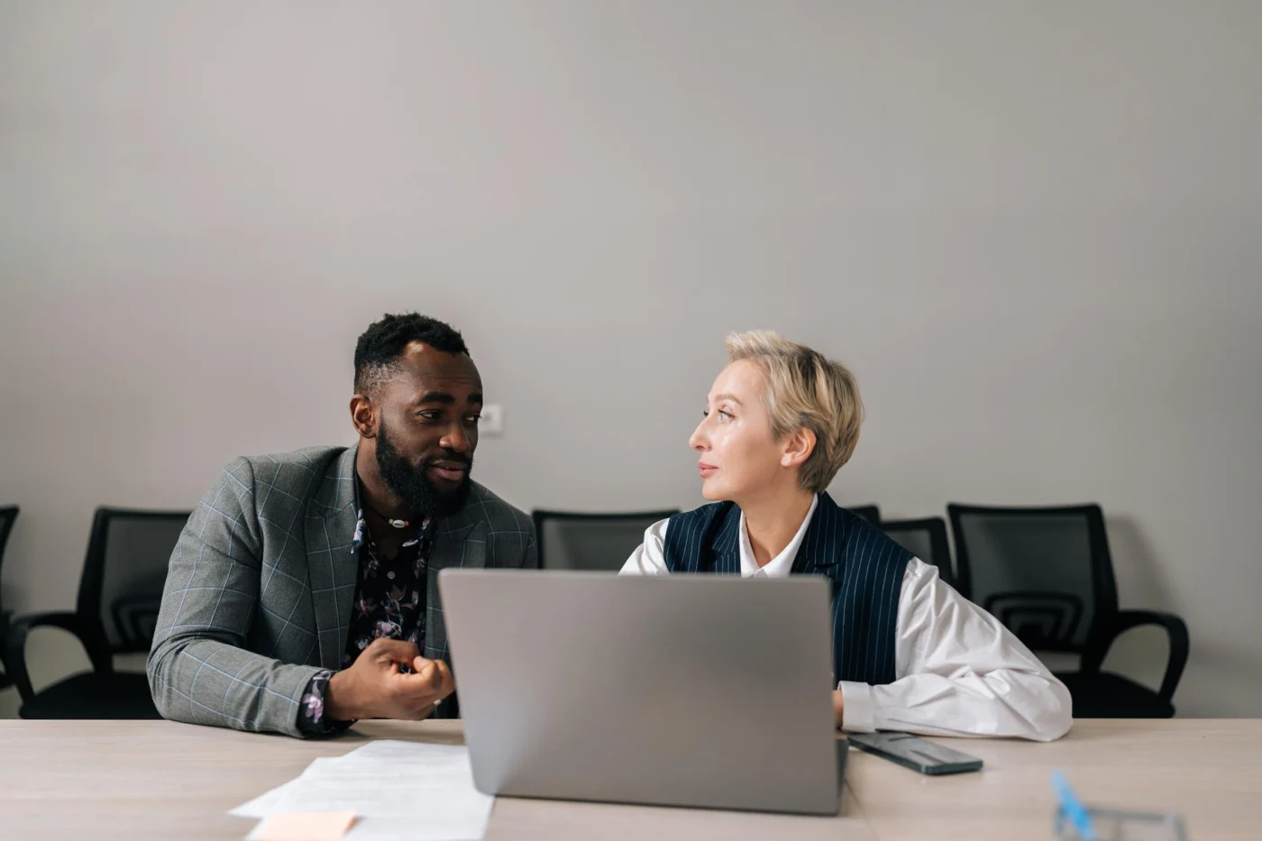 A hiring manager and candidate in conversation at a training provider
