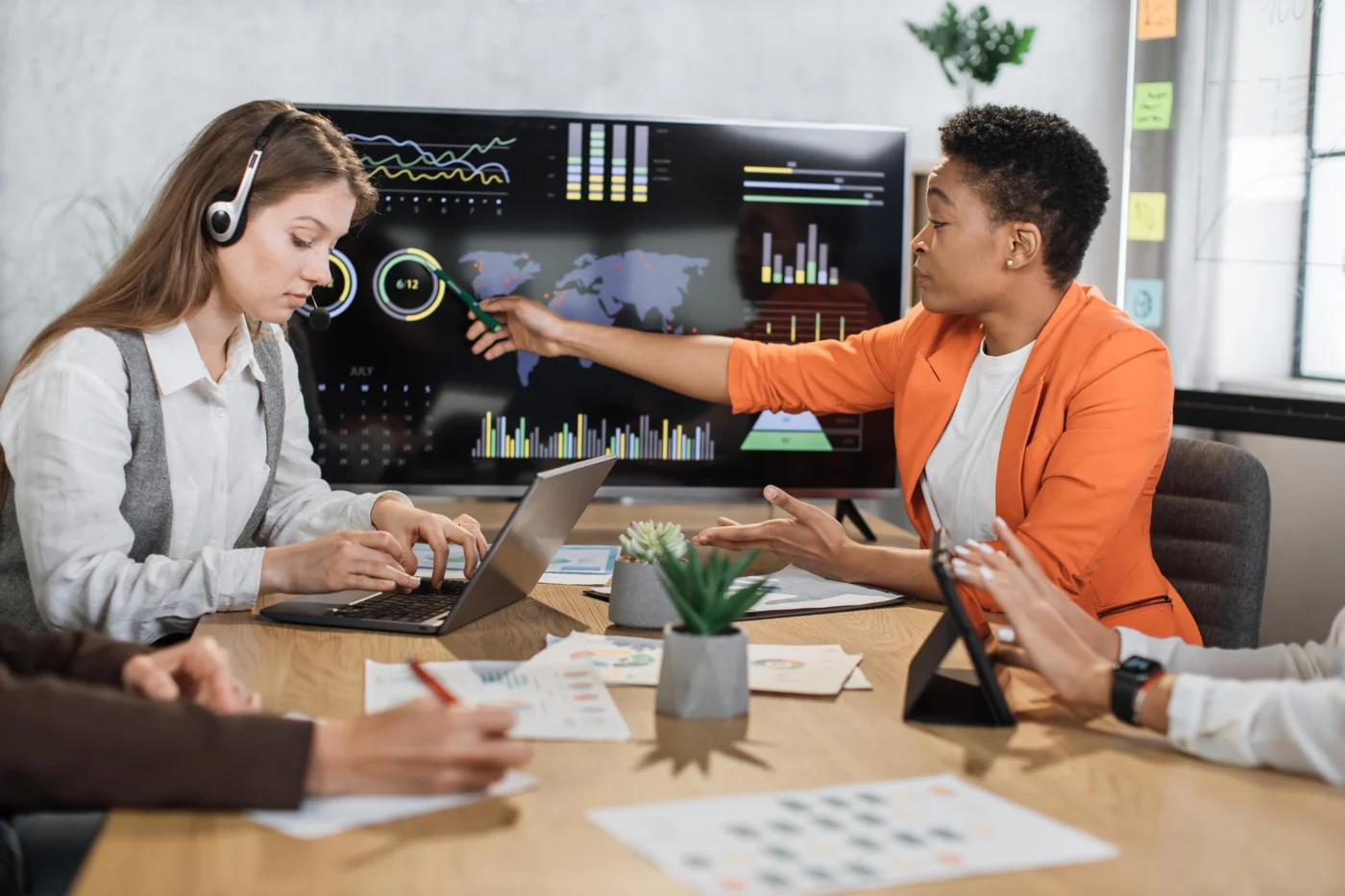 A team reviewing salary benchmarking data on screen