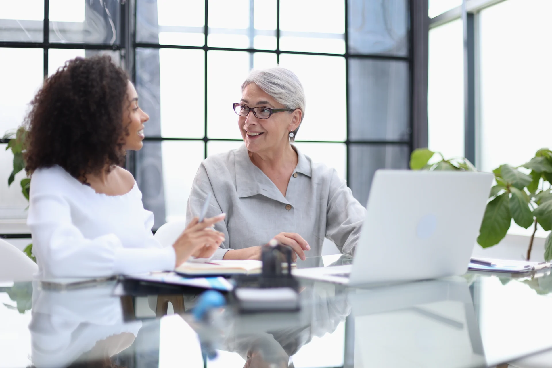 An employability advisor talking with an adult client during a one-to-one careers session