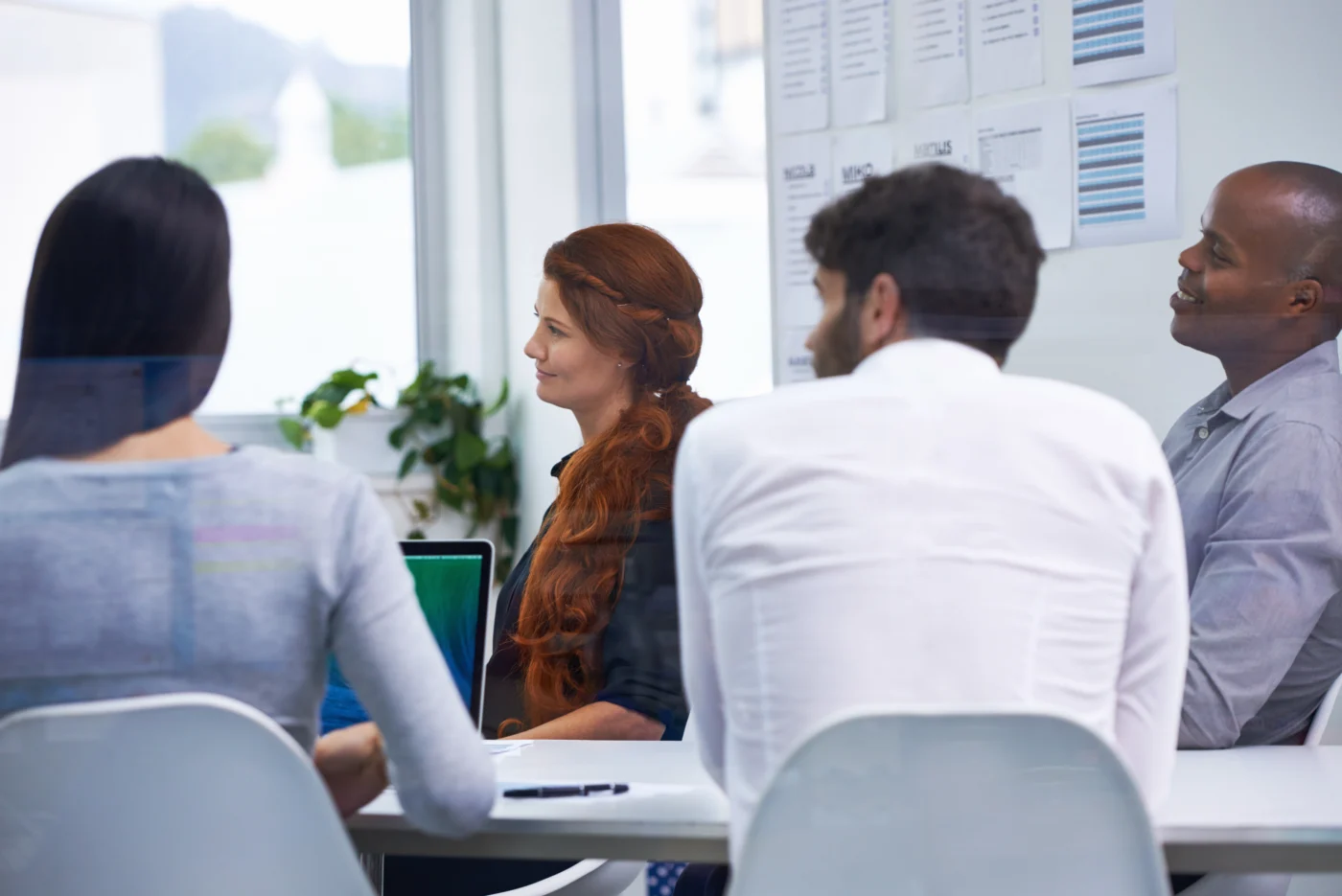 A training provider team reviewing funding and delivery plans in an office