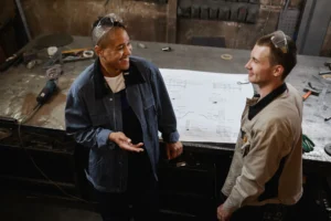 An independent assessor observing an adult apprentice complete a practical assessment