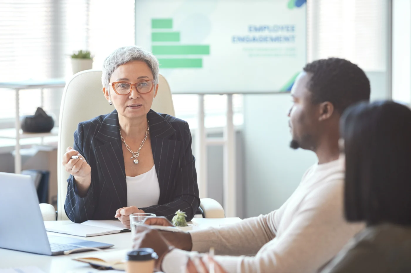 An adviser and a jobseeker working through an action plan together at a training provider