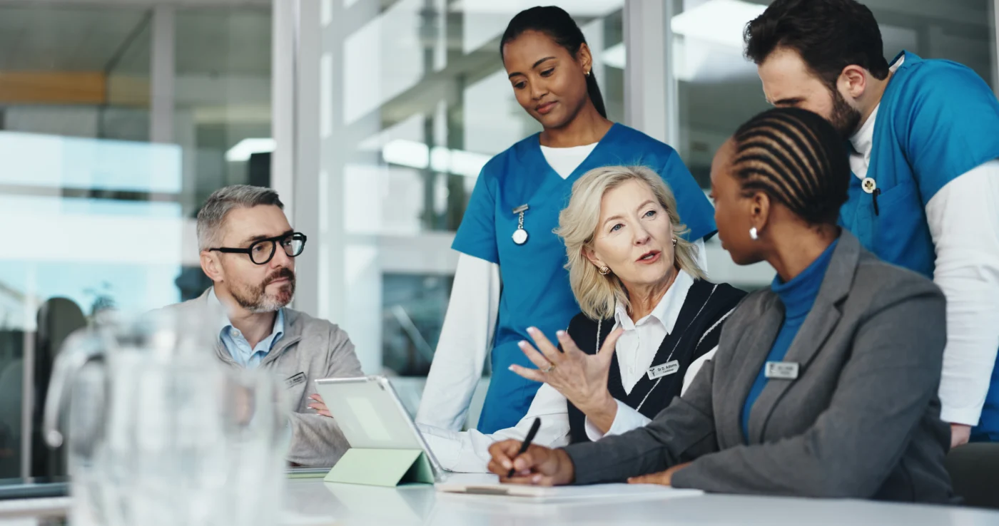 An employment specialist in a team meeting with clinical colleagues