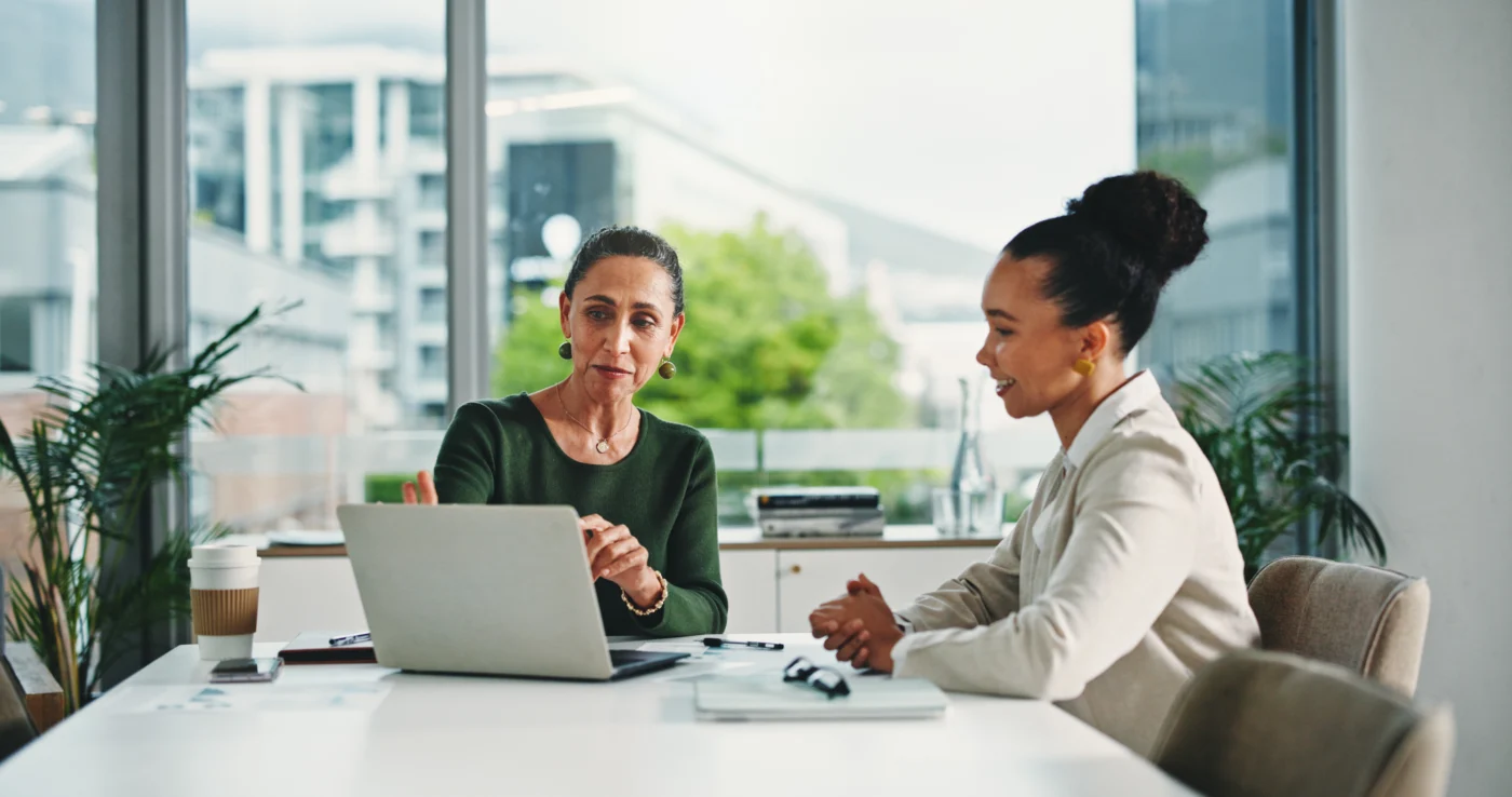 An employment specialist working with a client on a job application