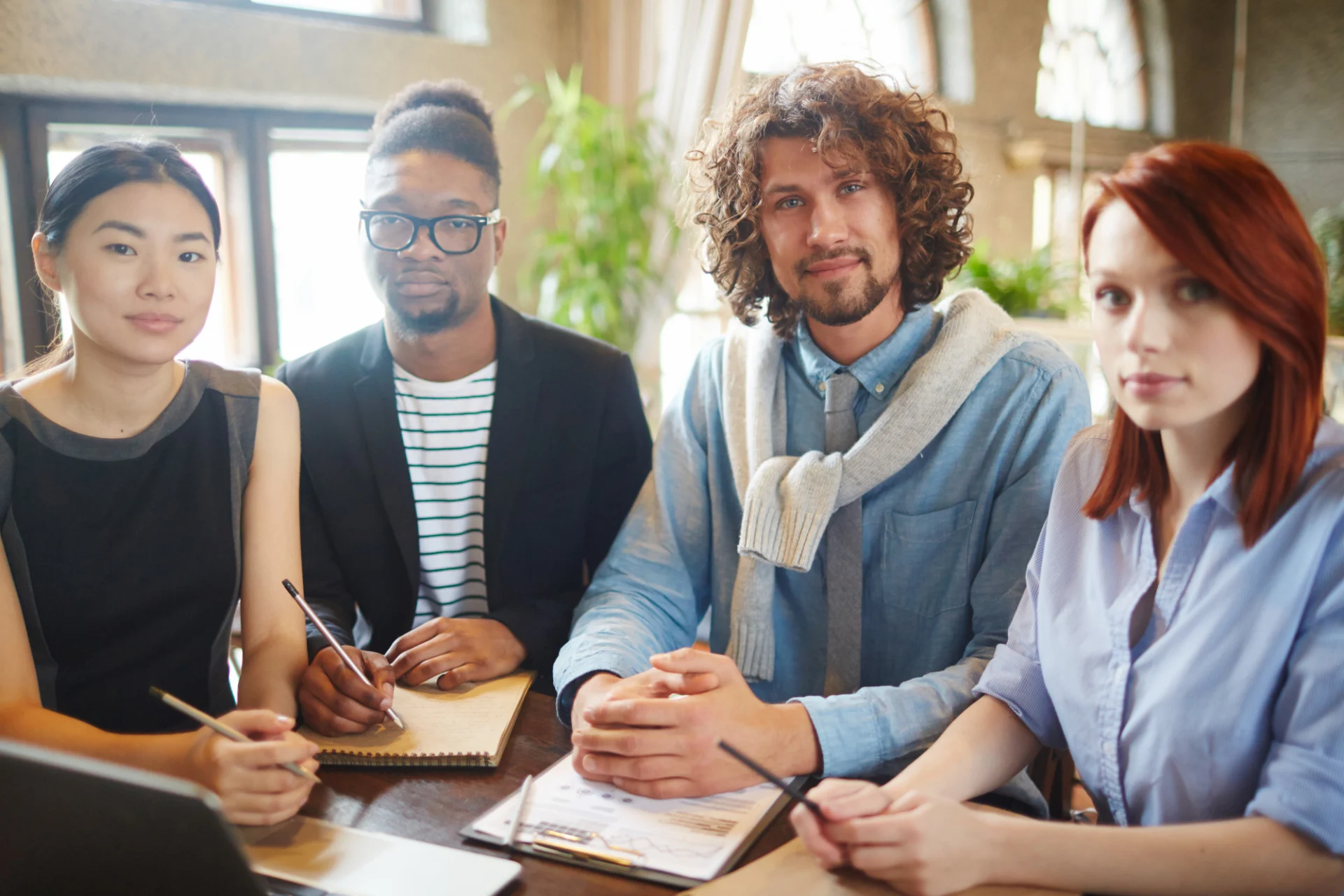 A college leadership and quality team reviewing inspection evidence together in a meeting