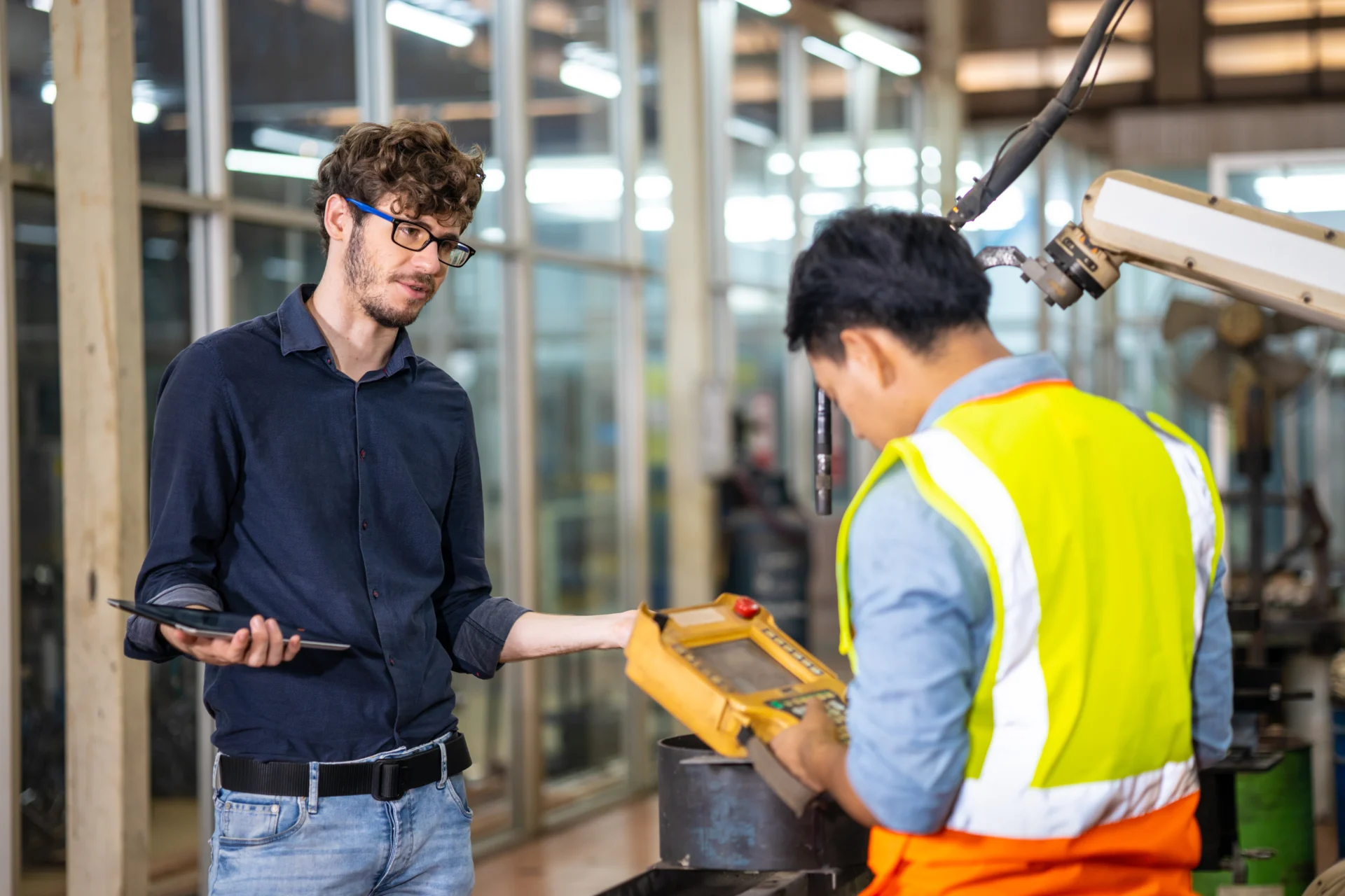 A young person in a first paid job being supported by a workplace mentor