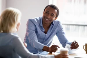 An employment specialist meeting a client in a community setting